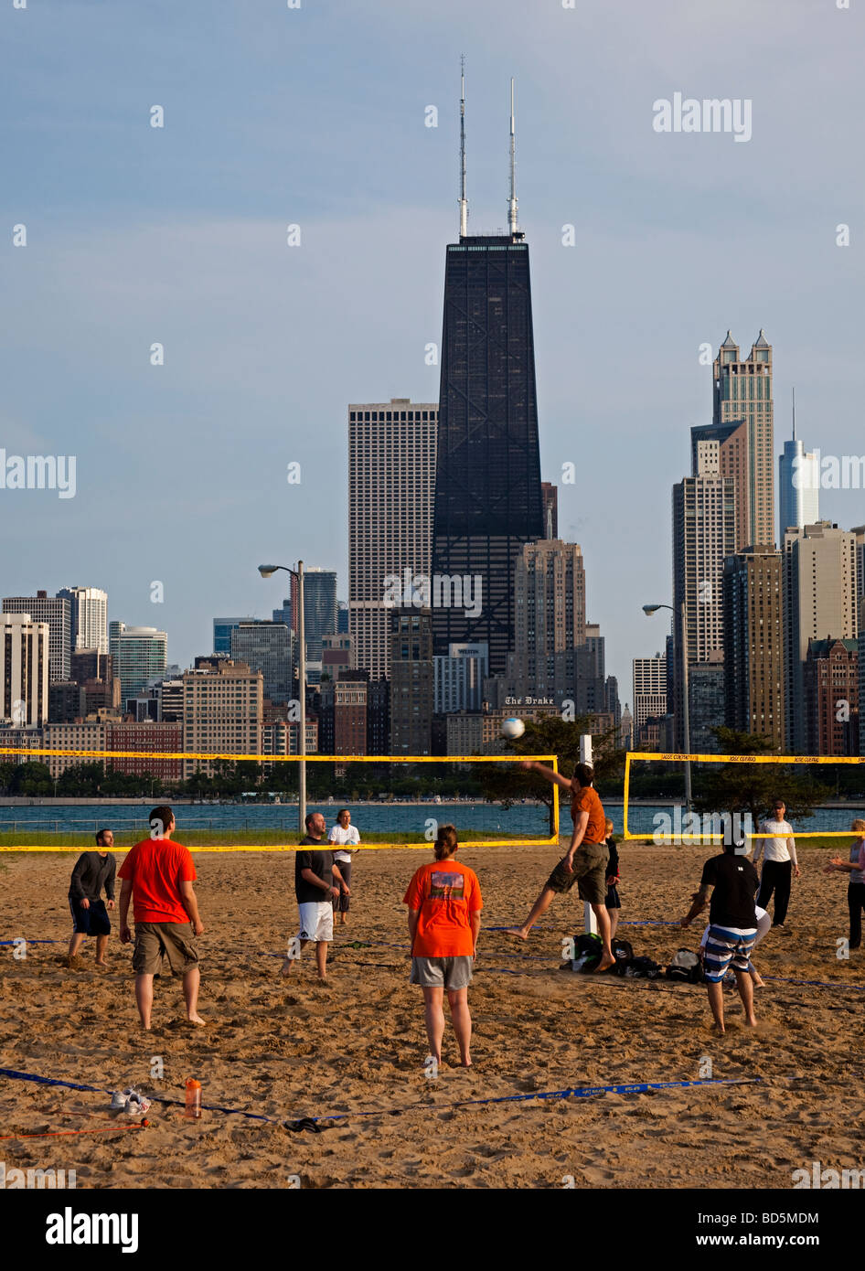 Male and female playing volleyball, Chicago, Illinois, USA Stock Photo