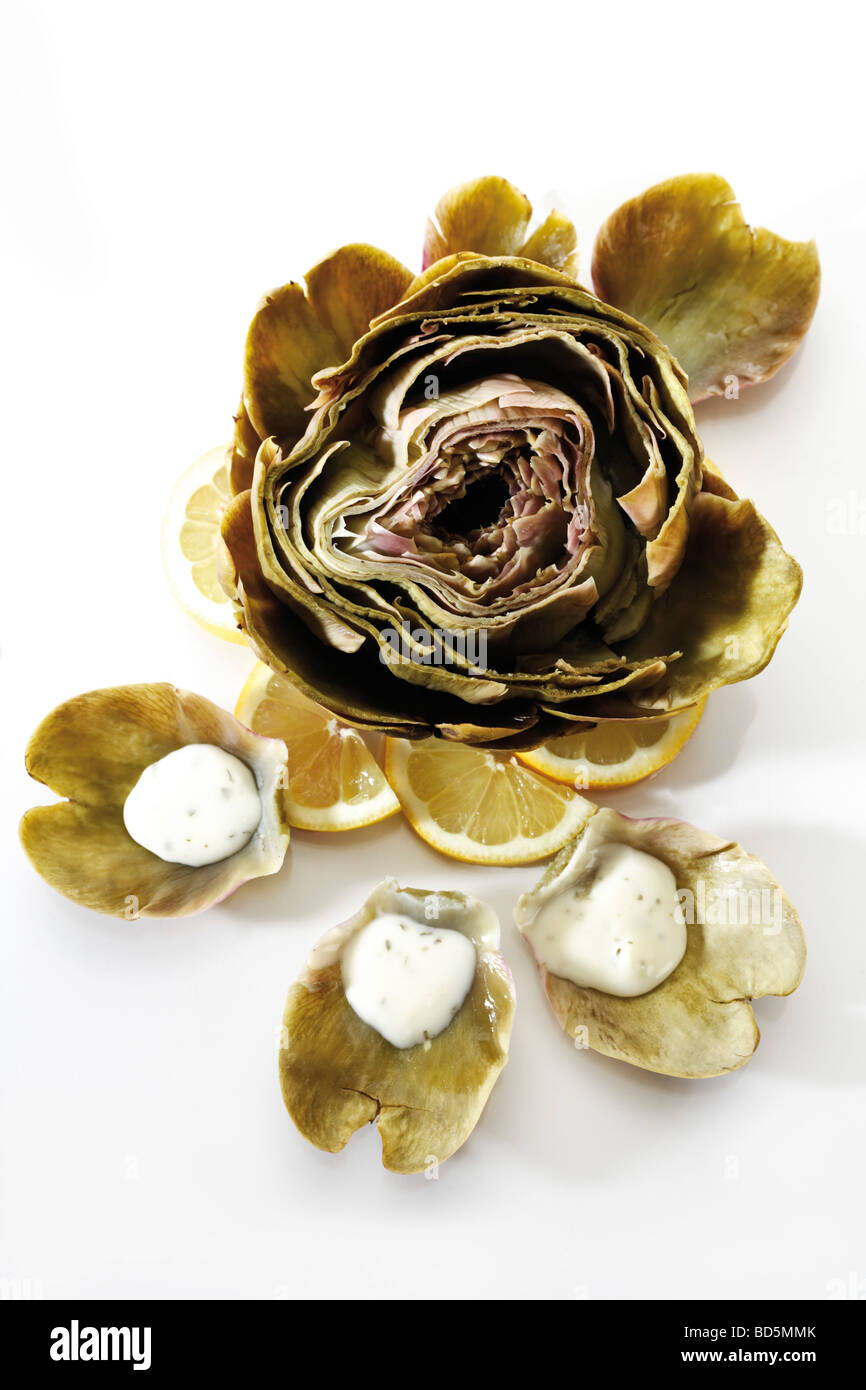 Boiled Artichoke with dip Stock Photo Alamy