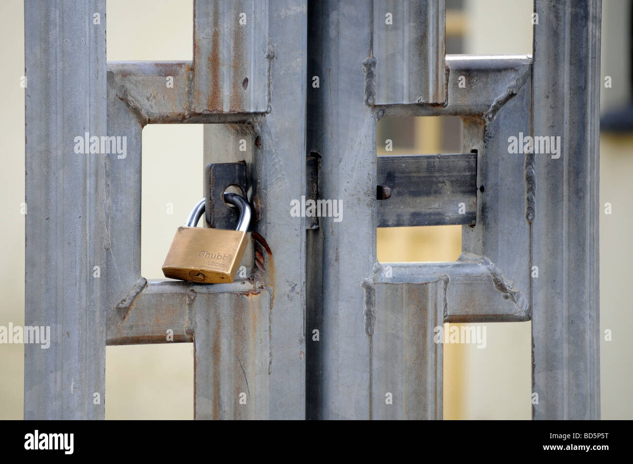 Royalty free photograph of industrial property with padlocked metal gates in London UK Stock Photo