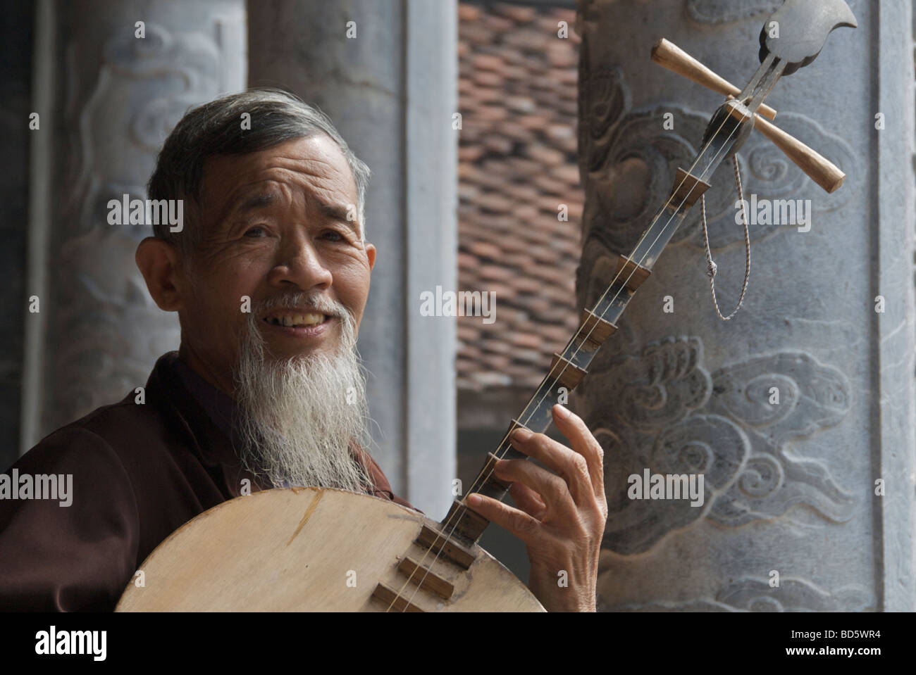 Musician playing Dan Nguyet or Moon Lute Tam Coc Ninh Binh Province Northern Vietnam Stock Photo