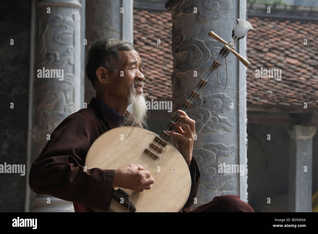 Musician playing Dan Nguyet or Moon Lute Tam Coc Ninh Binh Province Northern Vietnam Stock Photo