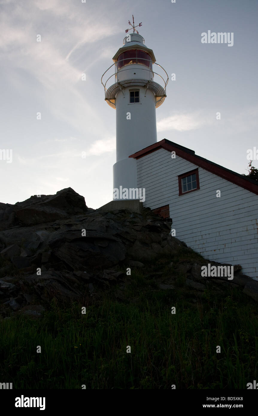 A view of the Lobster Cove Head lighthouse near sunset Stock Photo Alamy