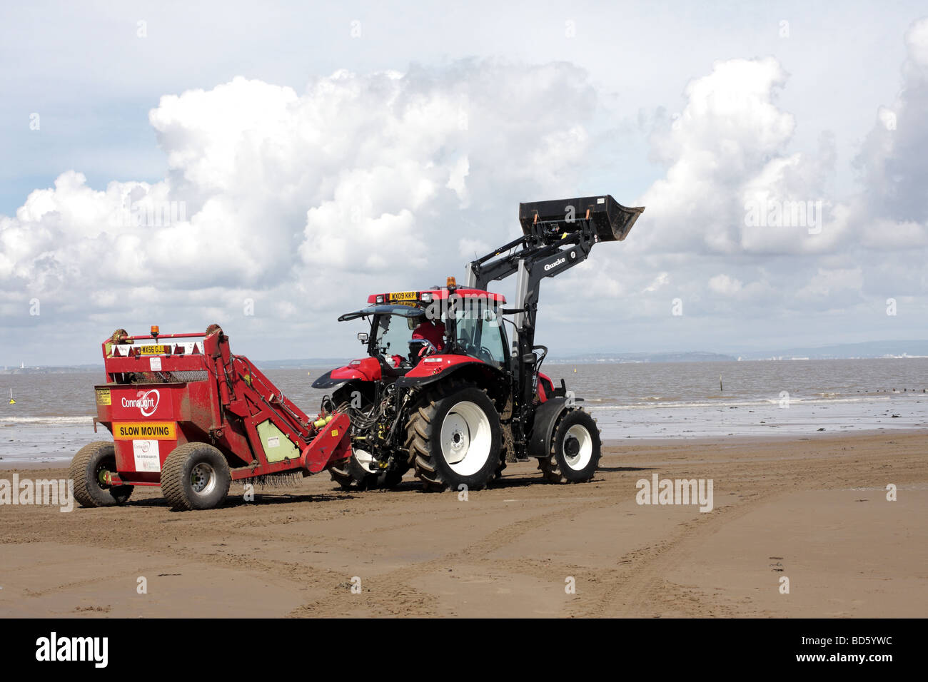 Tractor cleaning up the beach at Weston super Mare Stock Photo - Alamy