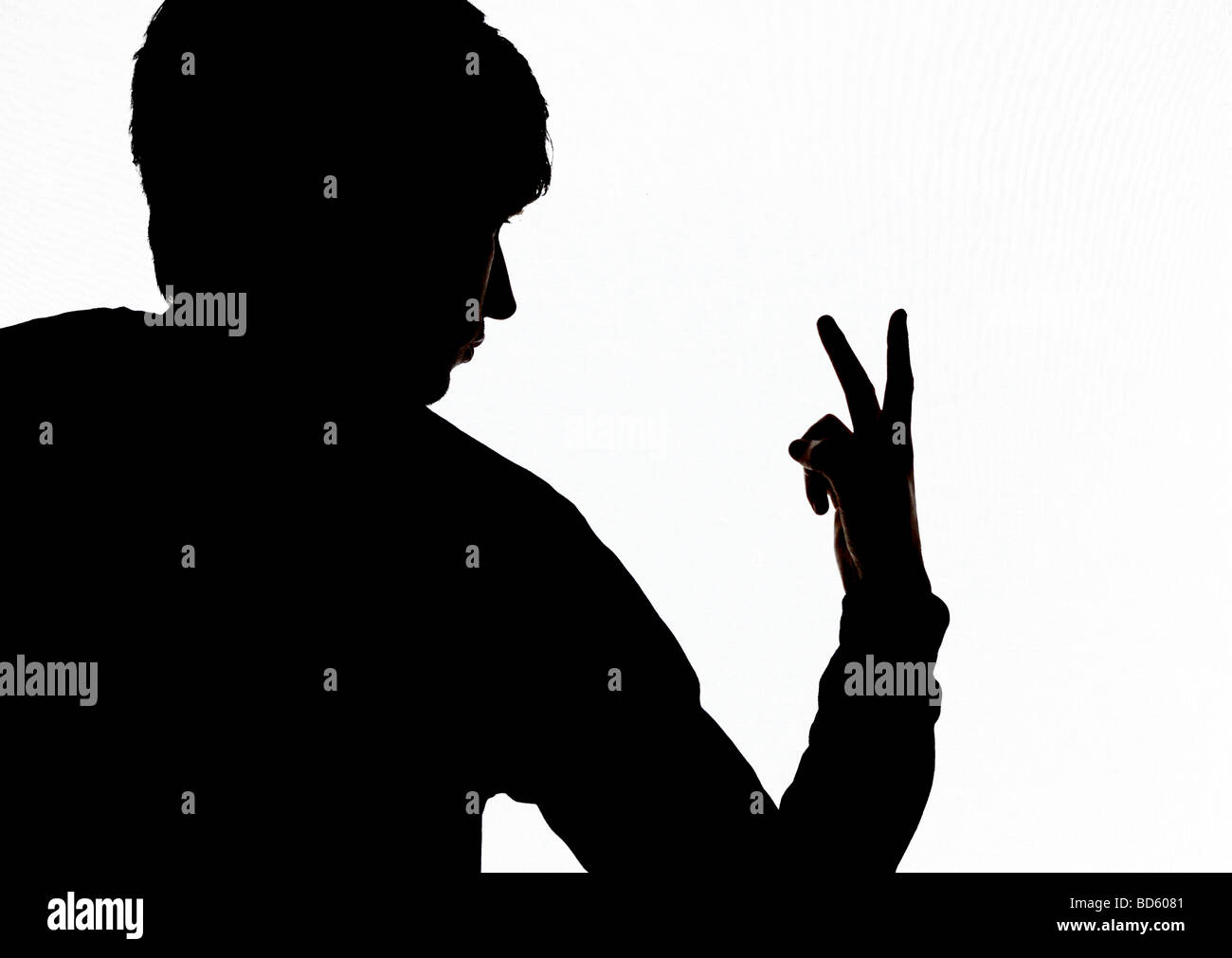Giving two fingers up Stock Photo - Alamy