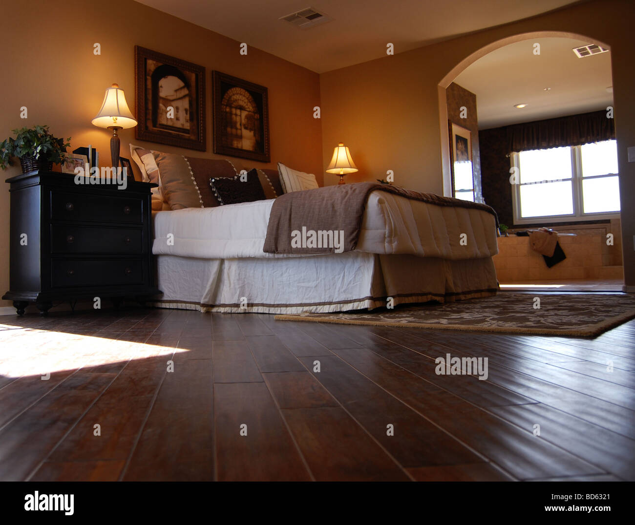 Large Beautiful Bedroom Interior With Dark Rich Hardwood