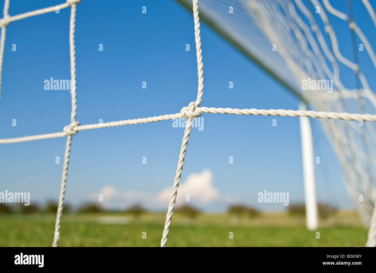 Soccer goal net against blue sky Stock Photo