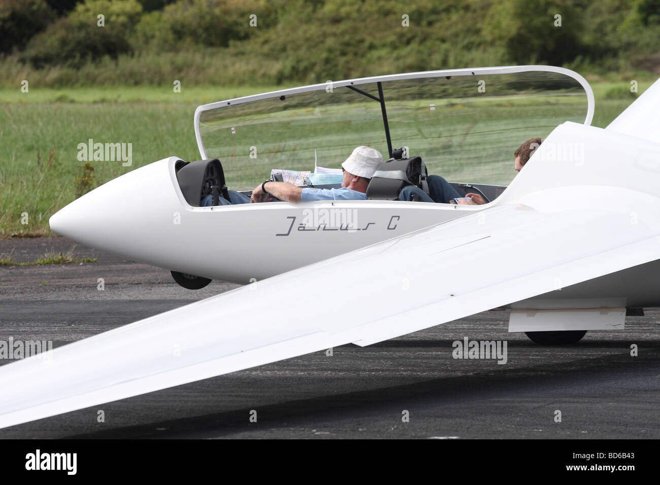 Glider pilots wait to launch in a Schempp Hirth Janus C  two seat trainer soaring sailplane Stock Photo