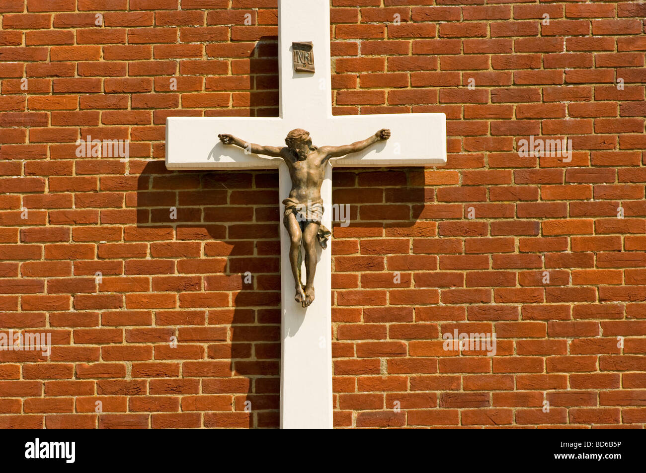 Statue of Jesus On The Cross Mounted On a Brick Wall Stock Photo Alamy