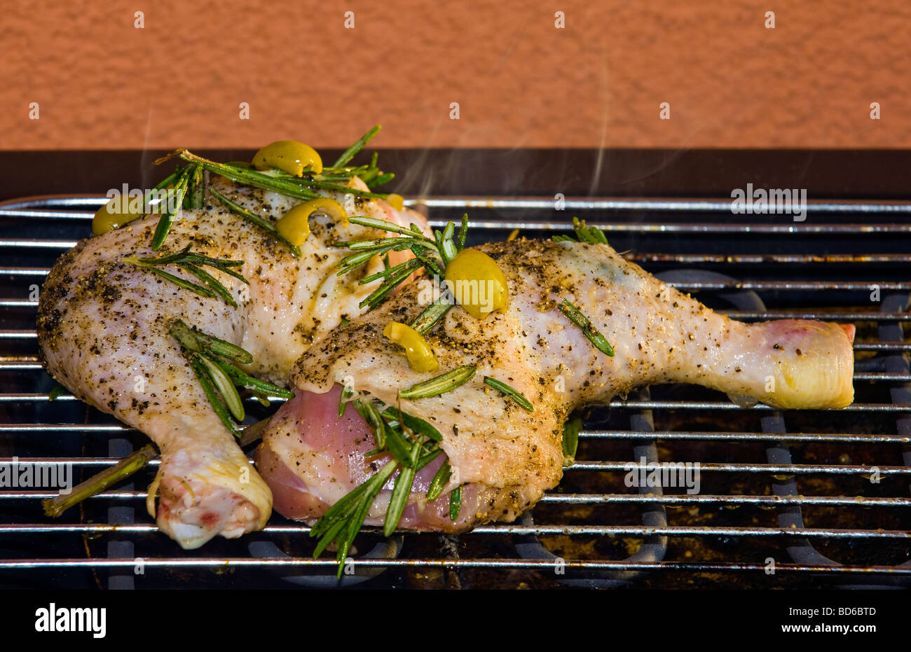 chicken legs with rosemary and olive grilling BBQ grilling open fire