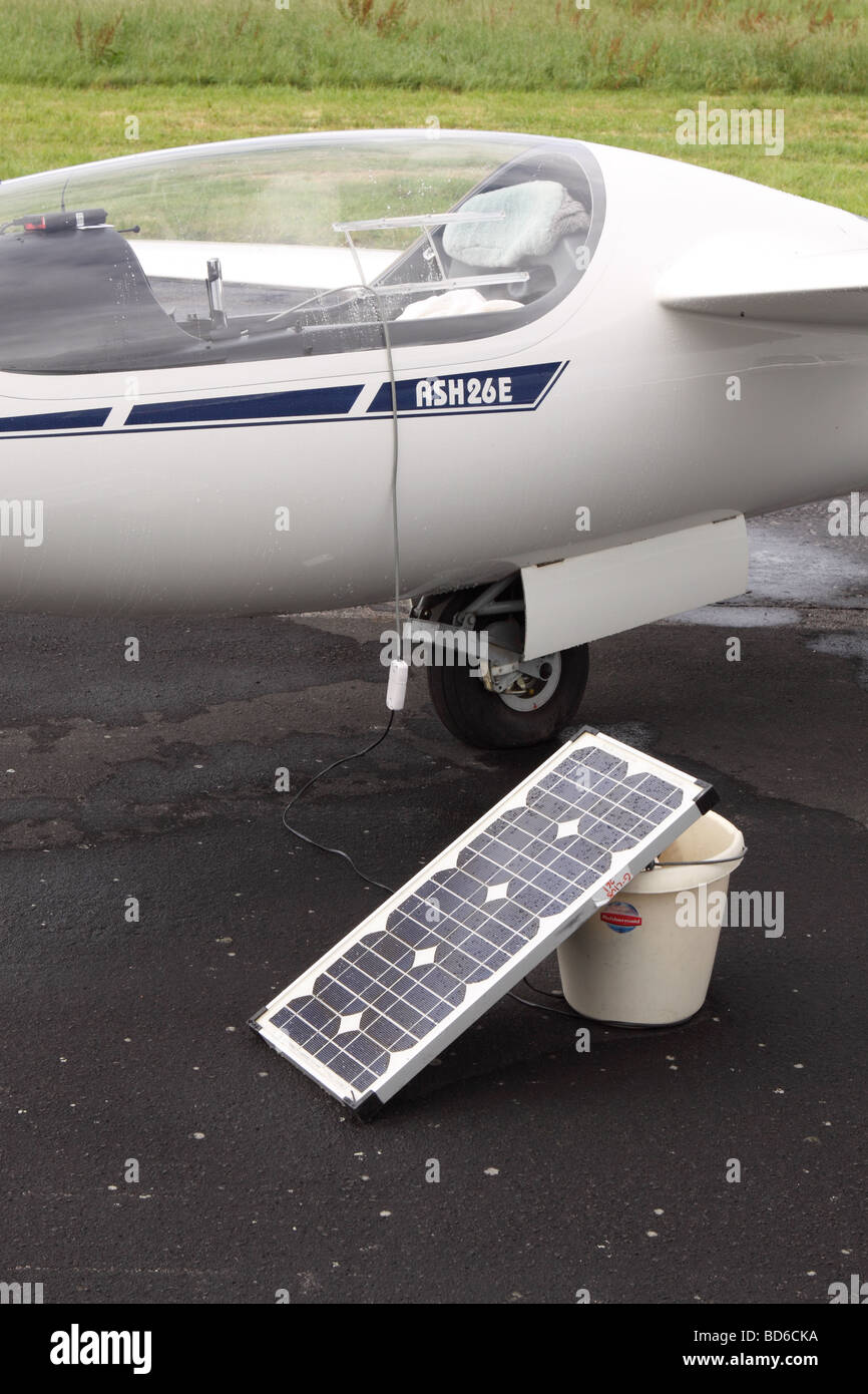 Glider with solar electricity energy panel used to charge recharge battery powered electrical devices in the cockpit such as GPS Stock Photo