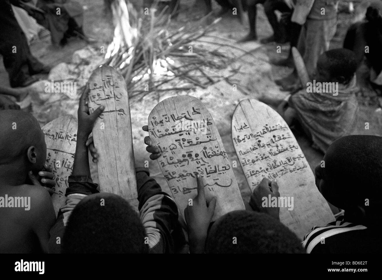 Children Chant The Koran Written On Wooden Tablets In Arabic Even Though Most Of Them Do Not Understand What They Are Reading Stock Photo Alamy