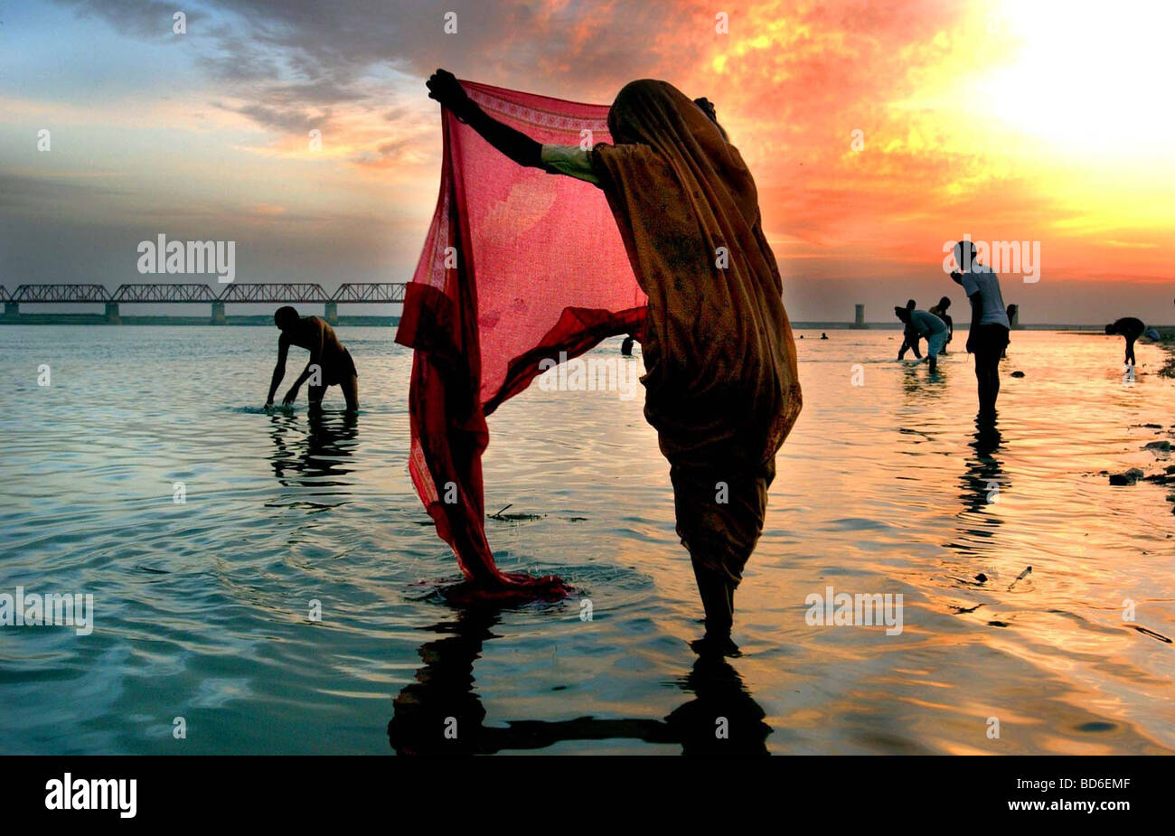 Hindus wash after making prayers to Lord Shiva at the river Saruj in the northern Indian city of Ayodhya at sunrise March 12 Stock Photo