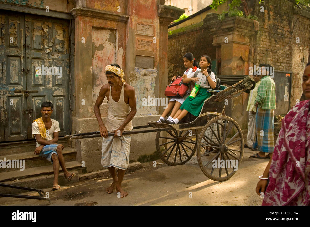 Kolkata s Calcutta rickshaw pullers take children to school and people
