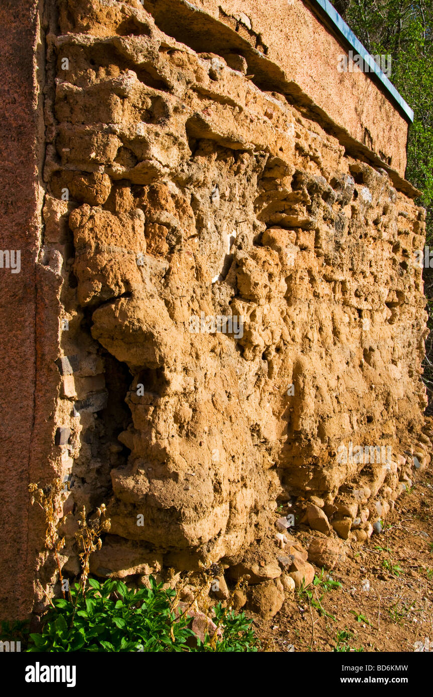 Old dilapidated adobe wall in Santa Fe NM Stock Photo