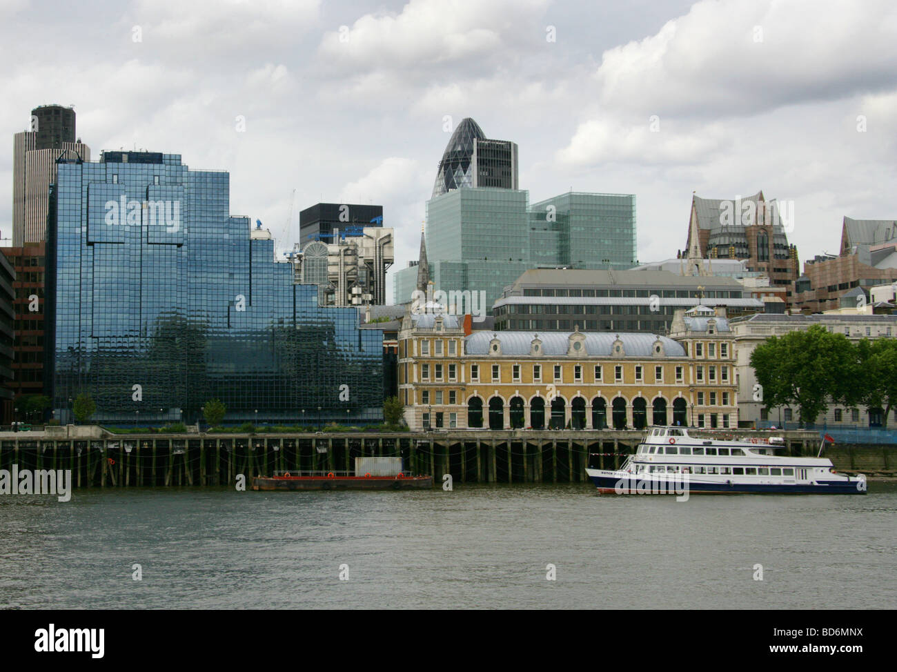 Old Billingsgate Fish Market and Northern and Shell Building, River Thames, from the Southbank, London, UK. Stock Photo