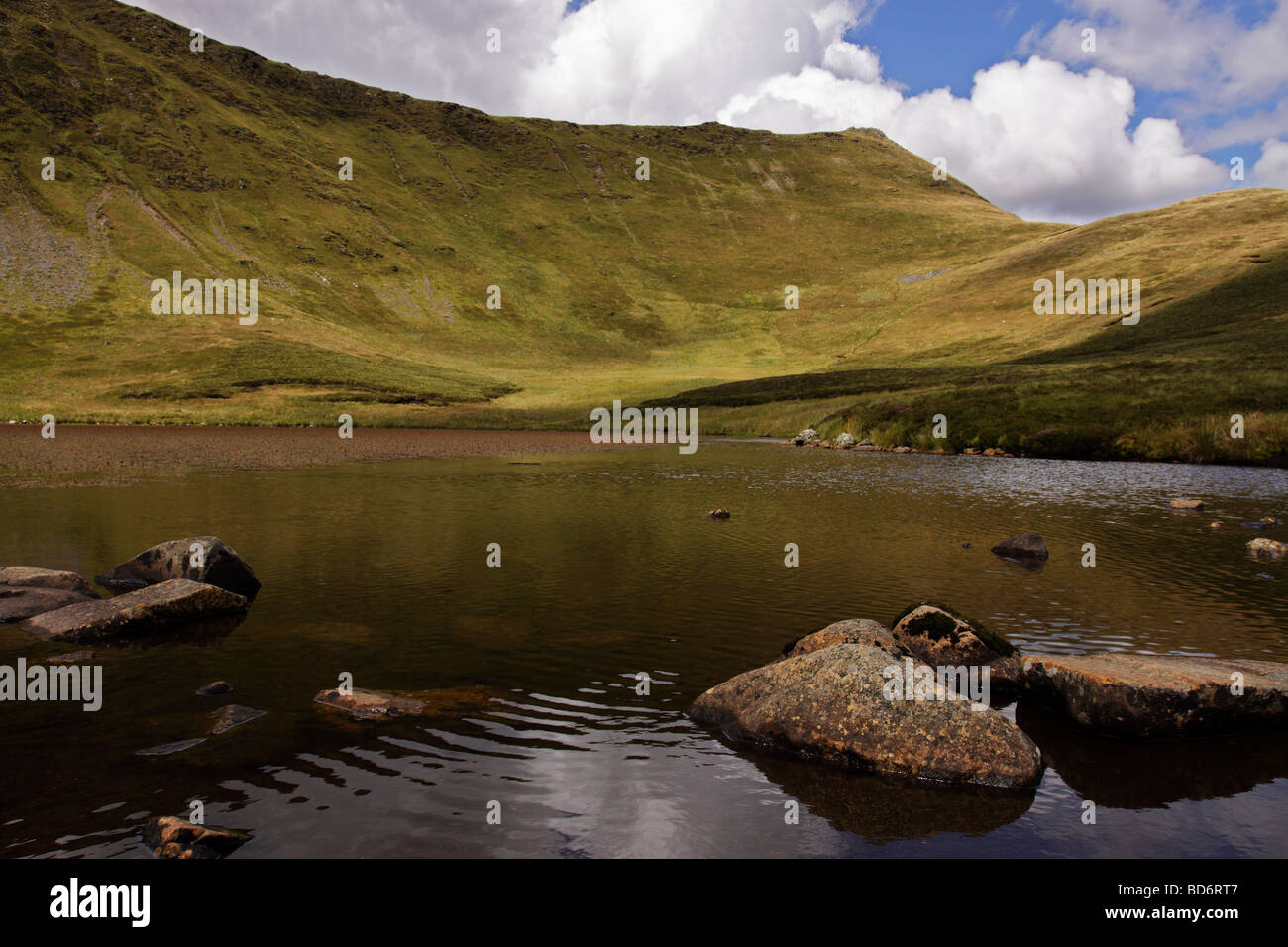 The lake of Llyn Lluncaws, below Cadair Berwyn in the Berwyn mountains, North Wales Stock Photo