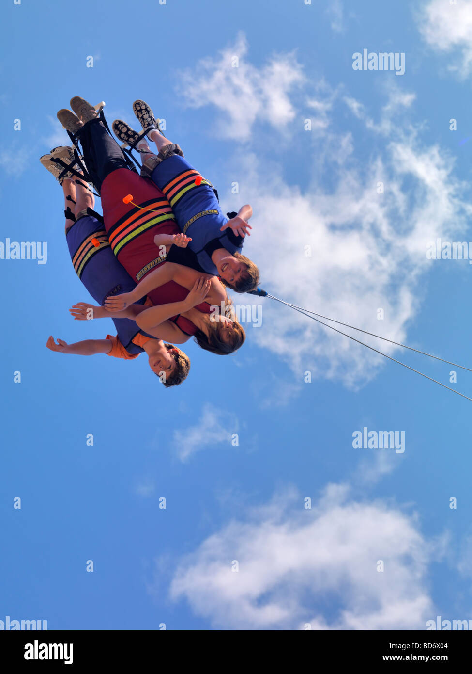 People enjoying Xtreme Skyflyer free-fall swing sky coaster Stock Photo