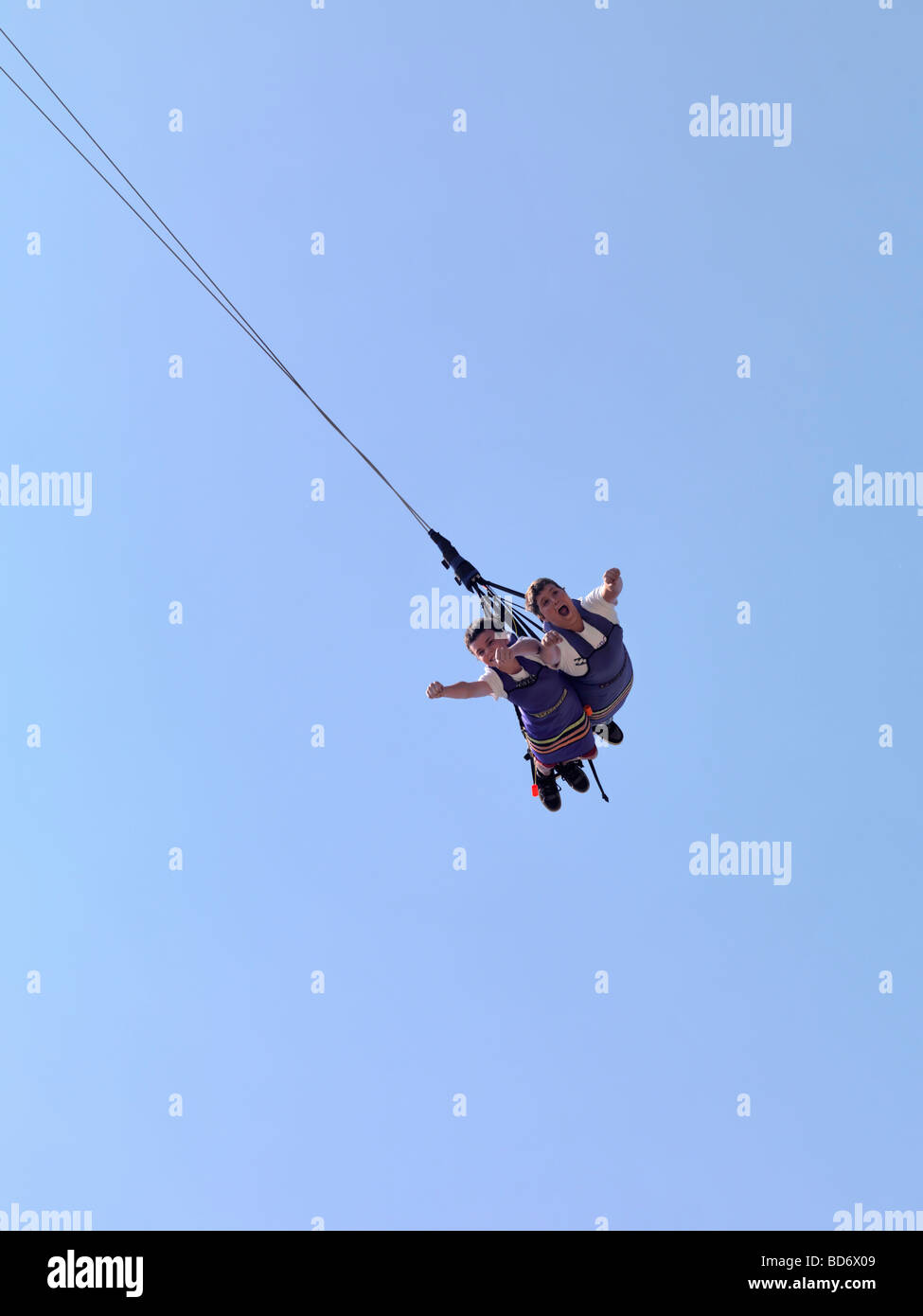 Kids enjoying Xtreme Skyflyer free-fall swing sky coaster Stock Photo