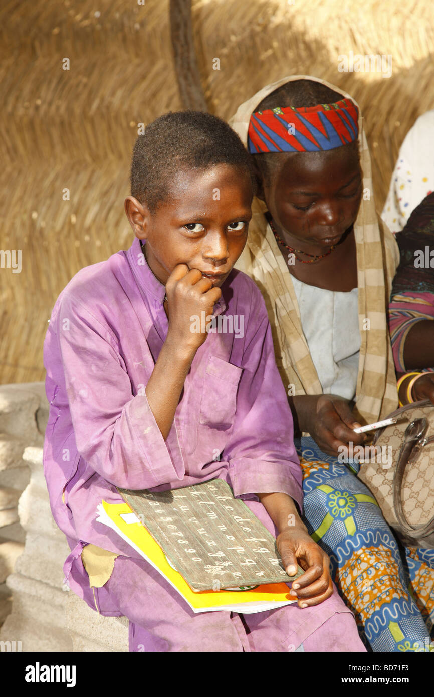 School children, a boy and a girl, during lessons, at Lagdo Lake, northern Cameroon, Cameroon, Africa Stock Photo