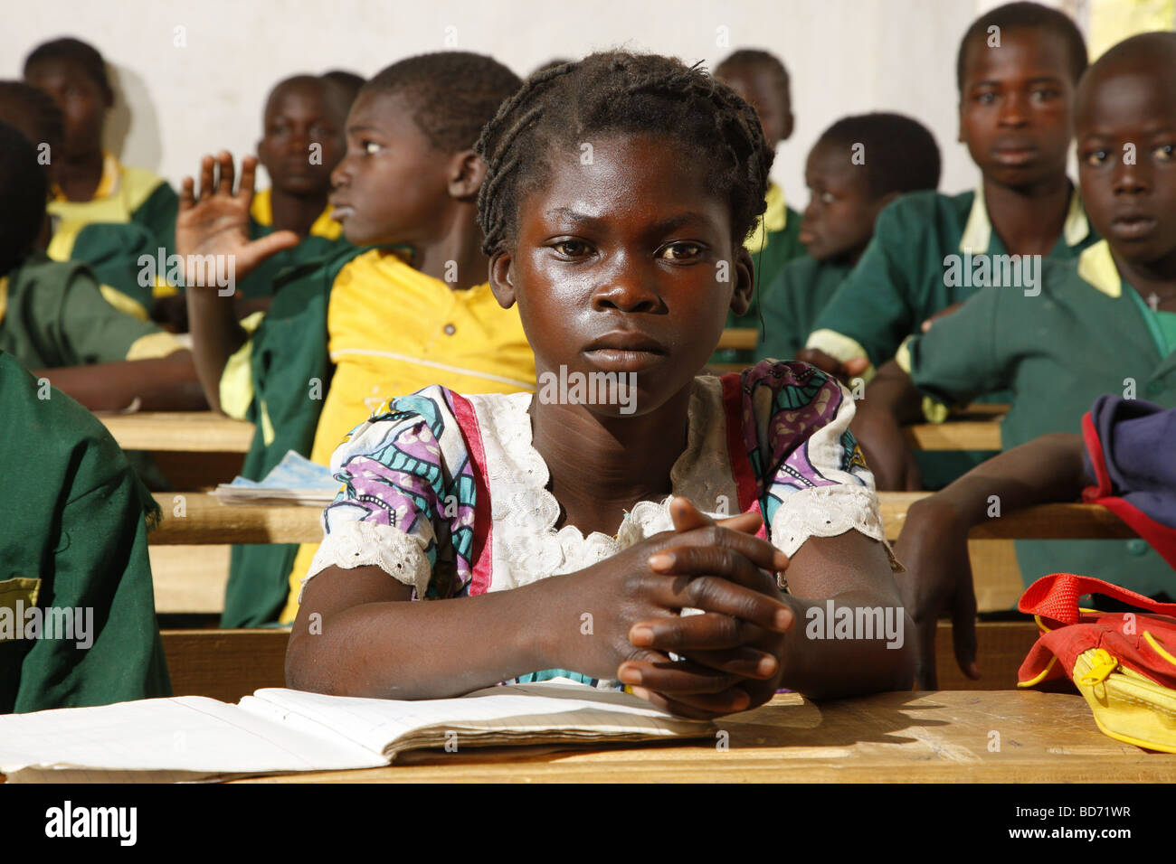 Girl without uniforms with classmates in uniform, during lessons, Mora, Cameroon, Africa Stock Photo