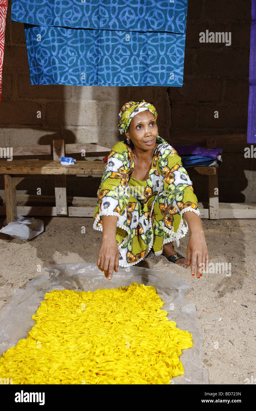 Woman preparing fabric for batik dyeing, working from home, Maroua, Cameroon, Africa Stock Photo