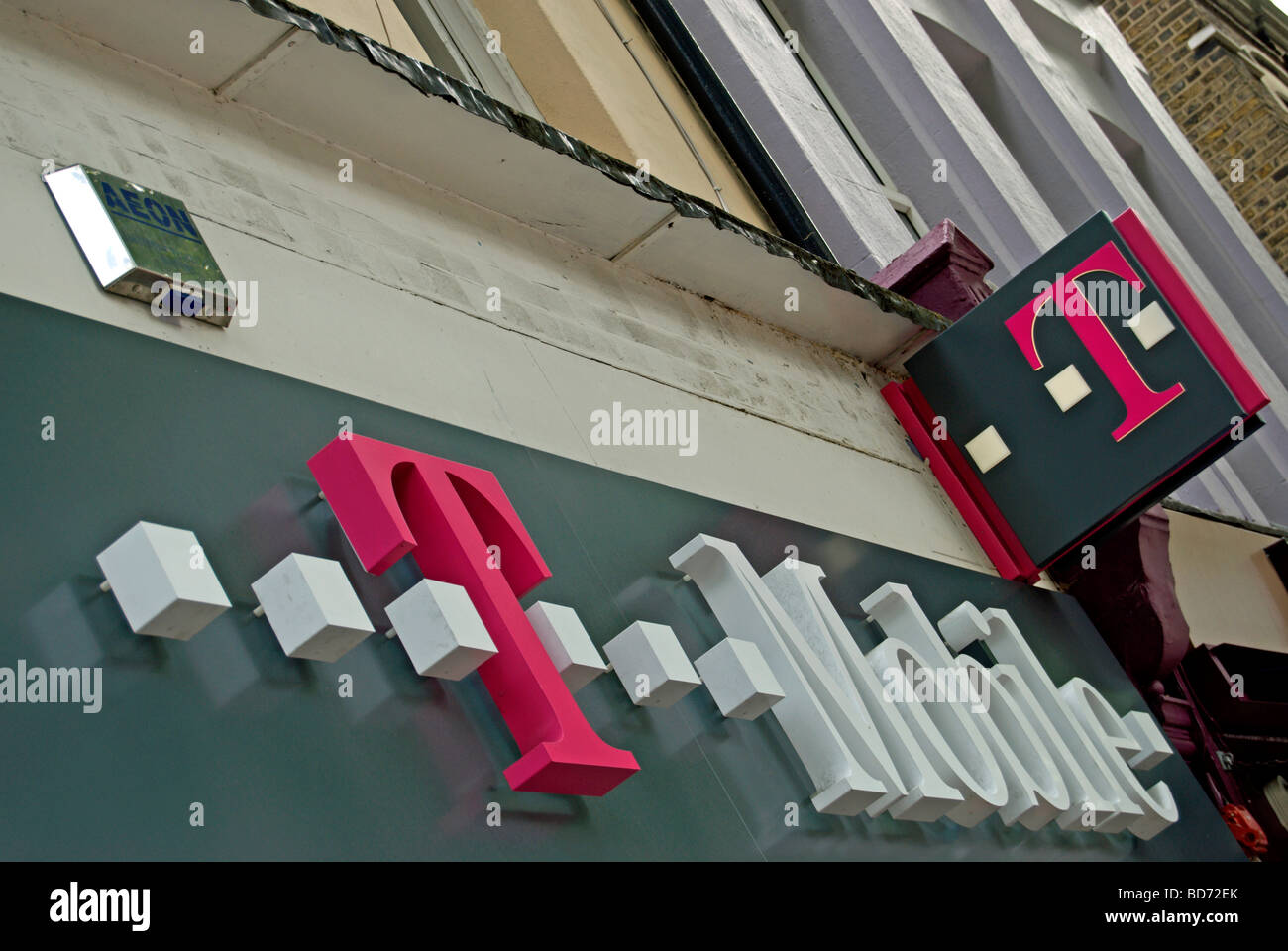 name and logo of mobile phone retailer t mobile in chiswick high road, west london, england Stock Photo