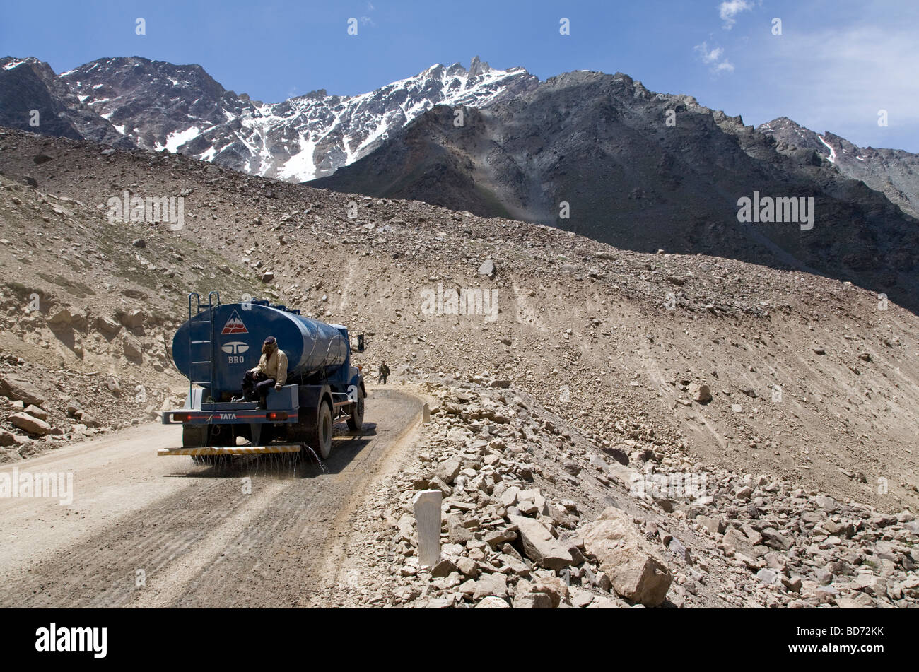 Water truck damping the road. Manali-Leh road. Ladakh. India Stock Photo