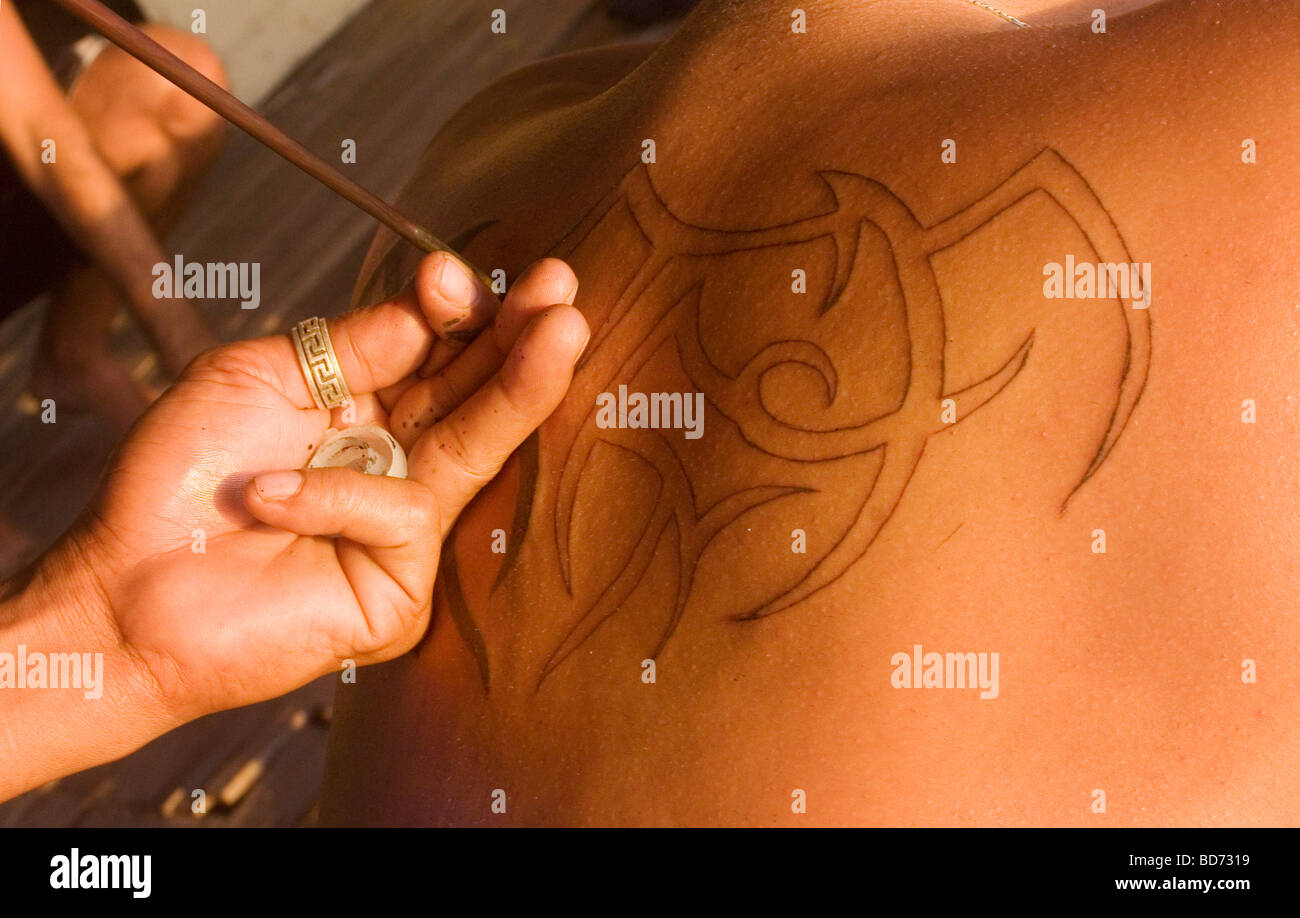 Man is given a traditional Thai bamboo tattoo. Unlike machine tattoo there  was no bleeding. Thailand Stock Photo - Alamy