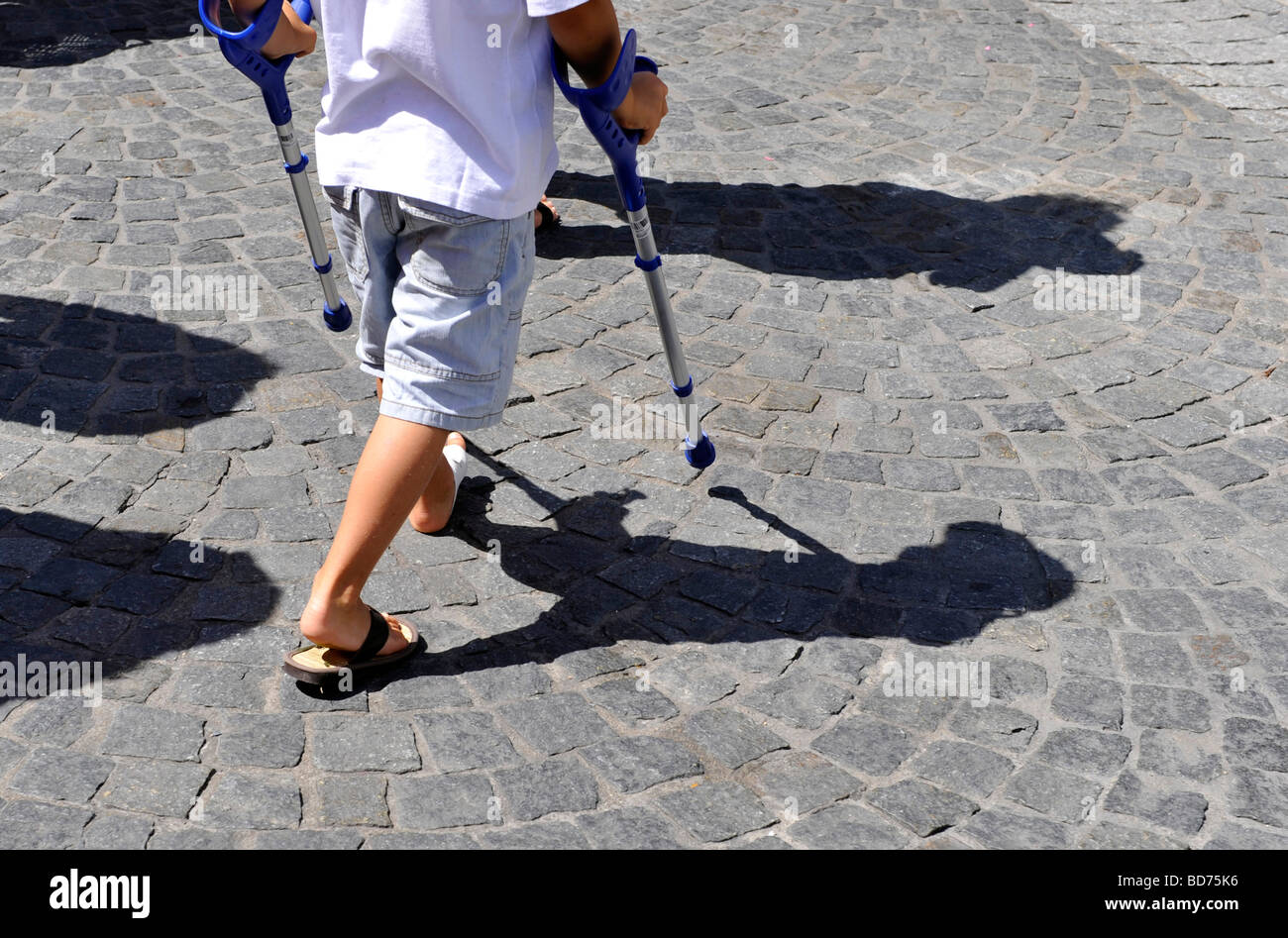 boy with crutches Stock Photo - Alamy