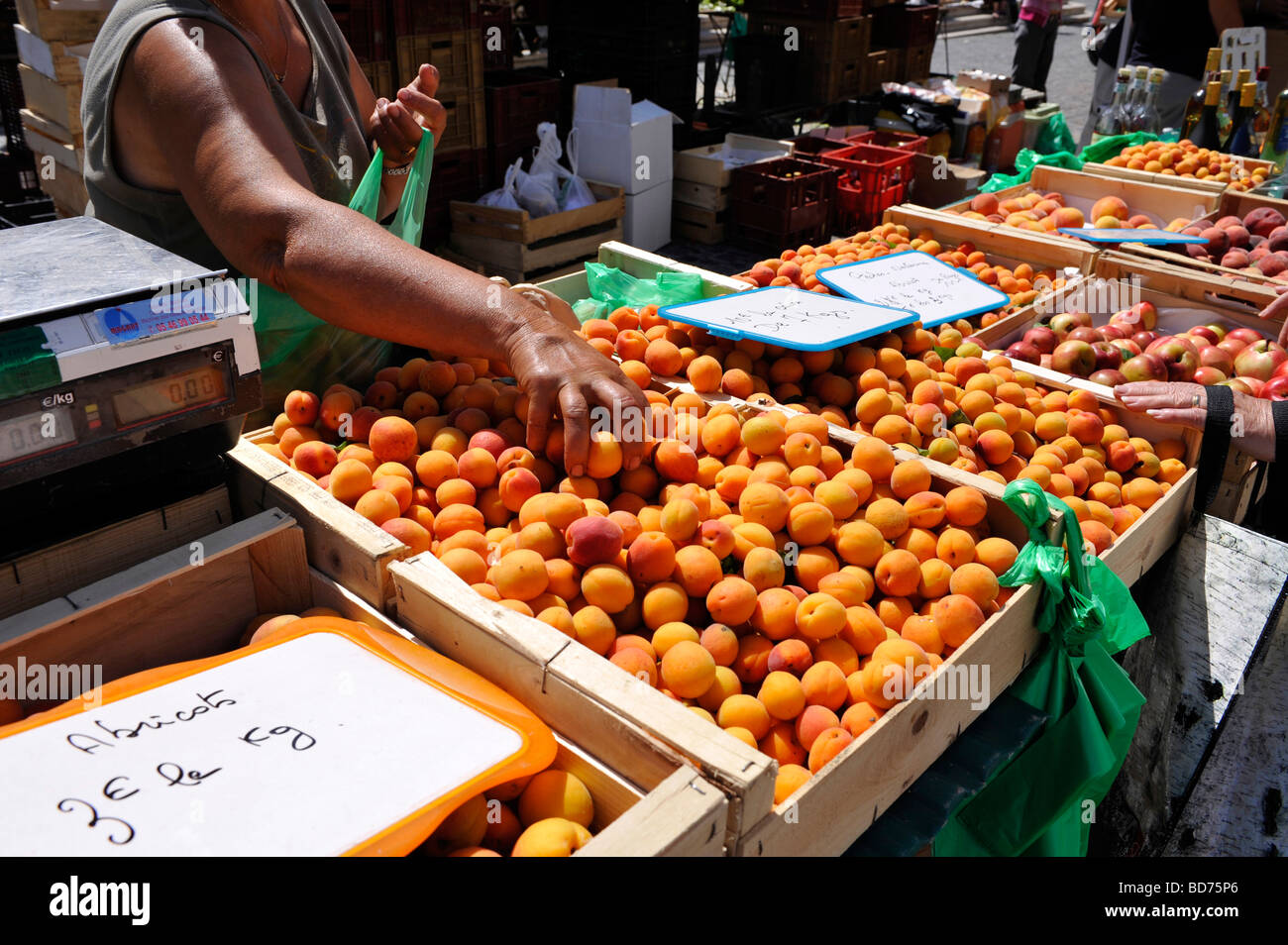 woman selling apricots French market Stock Photo