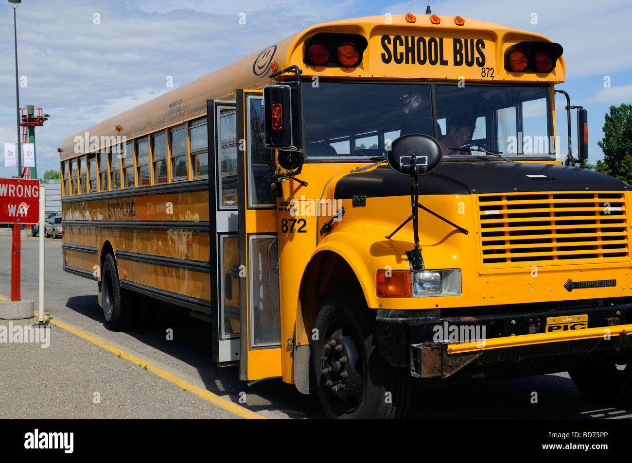 Typical Yellow School bus in Calgary is the largest city in the Province of Alberta, Canada. Stock Photo