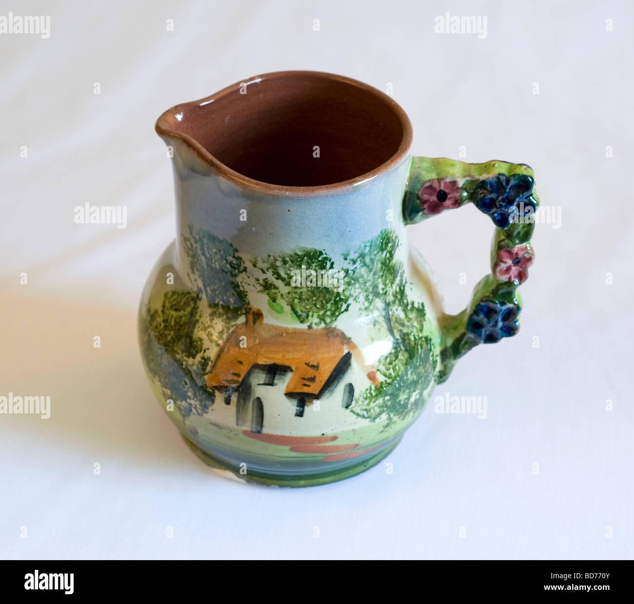 Torquay Ware decorated pottery jug floral handle Stock Photo Alamy