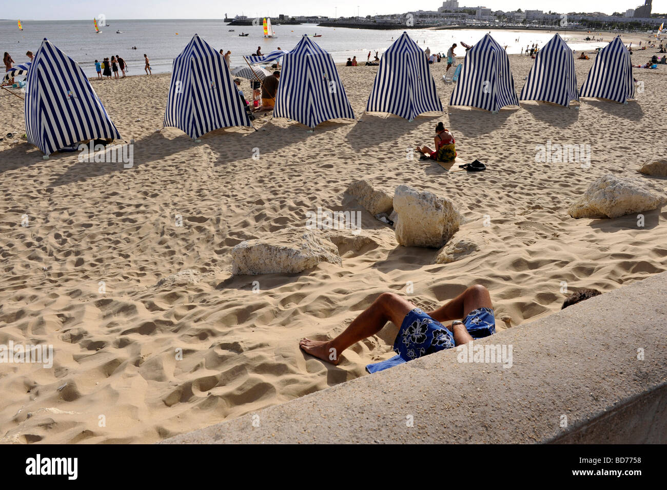 beach changing tents Royan France legs sunbathe Stock Photo