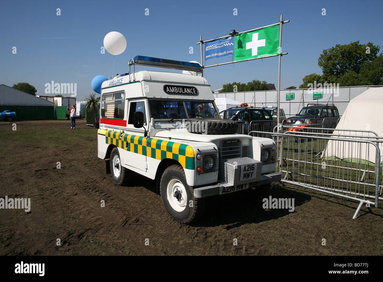 Series 2 Land Rover ambulance awaits casualties at a first aid post during a music festival. Stock Photo