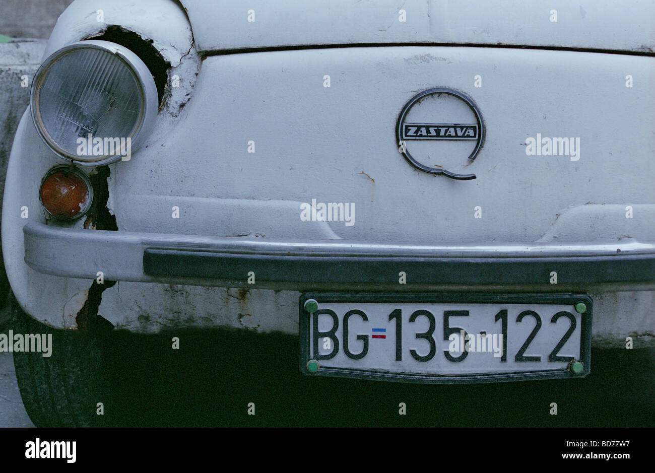 Parking white and rusty Zastava car with Belgrade license plate, Serbia, Balkans Stock Photo