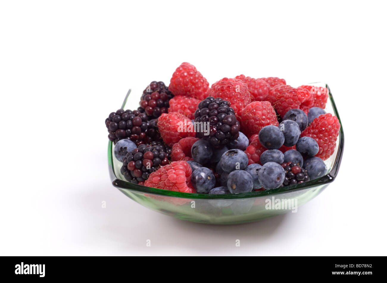 Dish of mixed berries on a white background Stock Photo