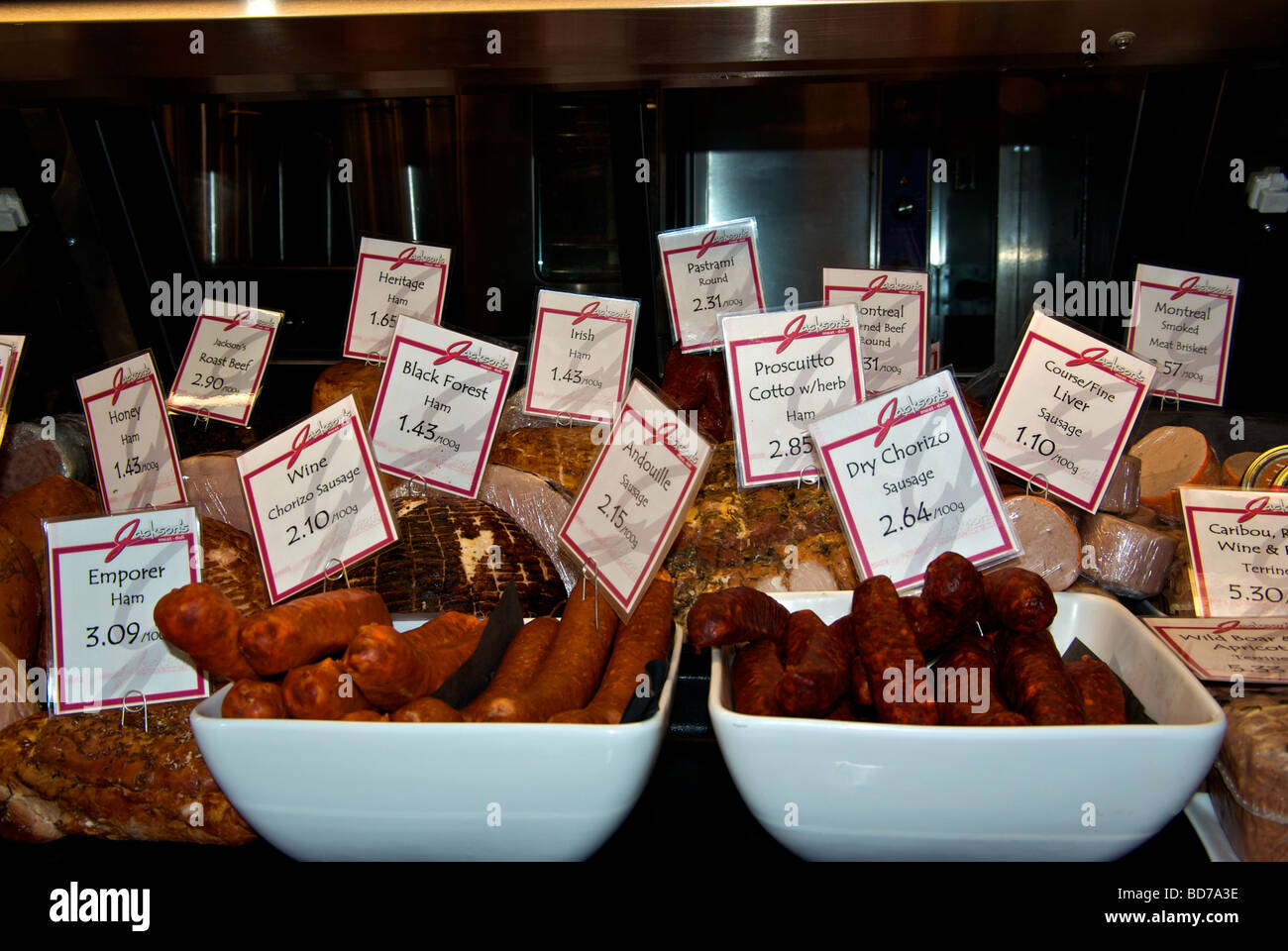 Delicatessen specialty cured meats sausages hams bacon Stock Photo Alamy