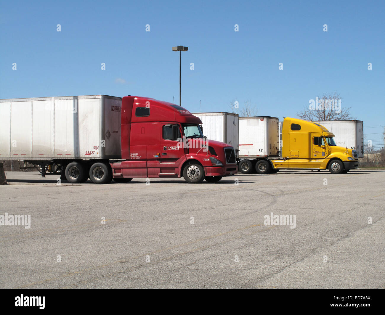 Tractor trailers parked at truck stop. Stock Photo