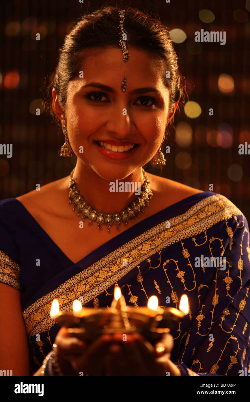 woman holding oil lamp Stock Photo Alamy
