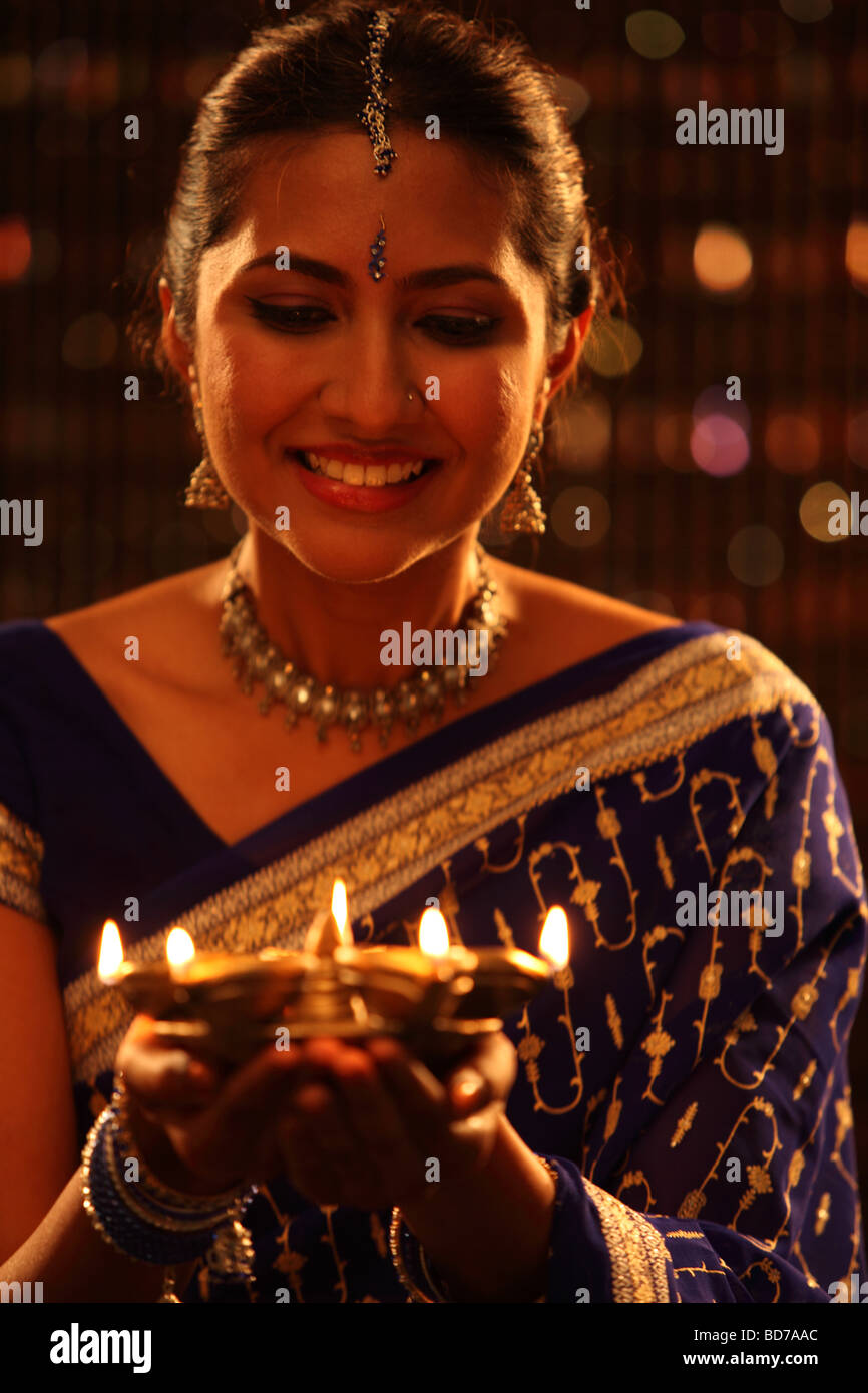 woman holding oil lamp Stock Photo Alamy