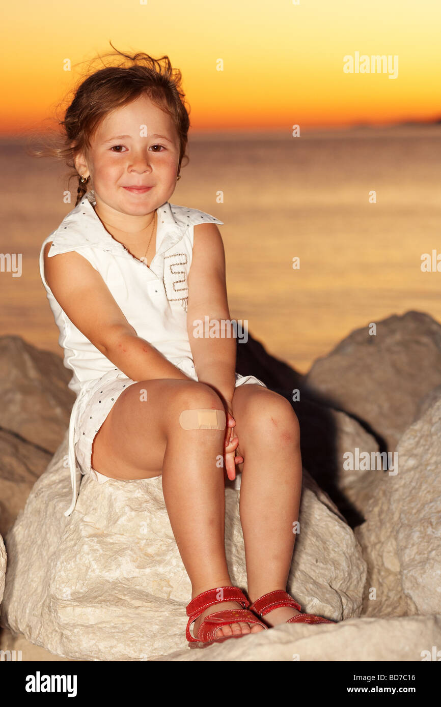 Young girl by the sunset Stock Photo - Alamy