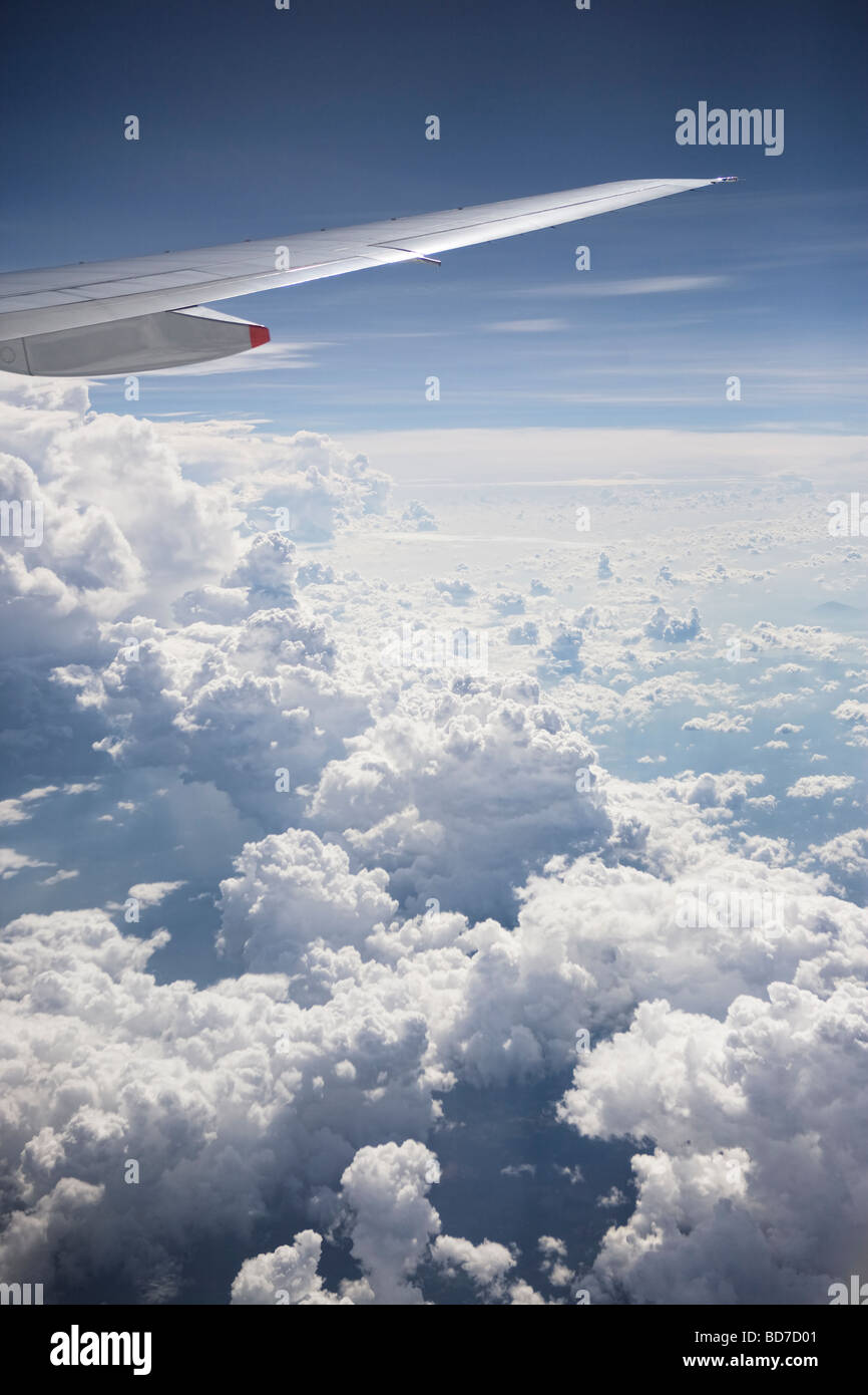 Flying above the clouds over South-East Asia Stock Photo