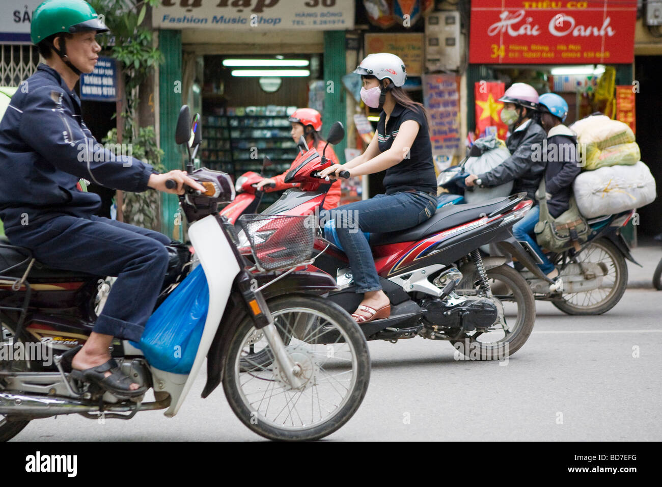 People riding scooters/mopeds in Vietnam in Hanoi Stock Photo Alamy