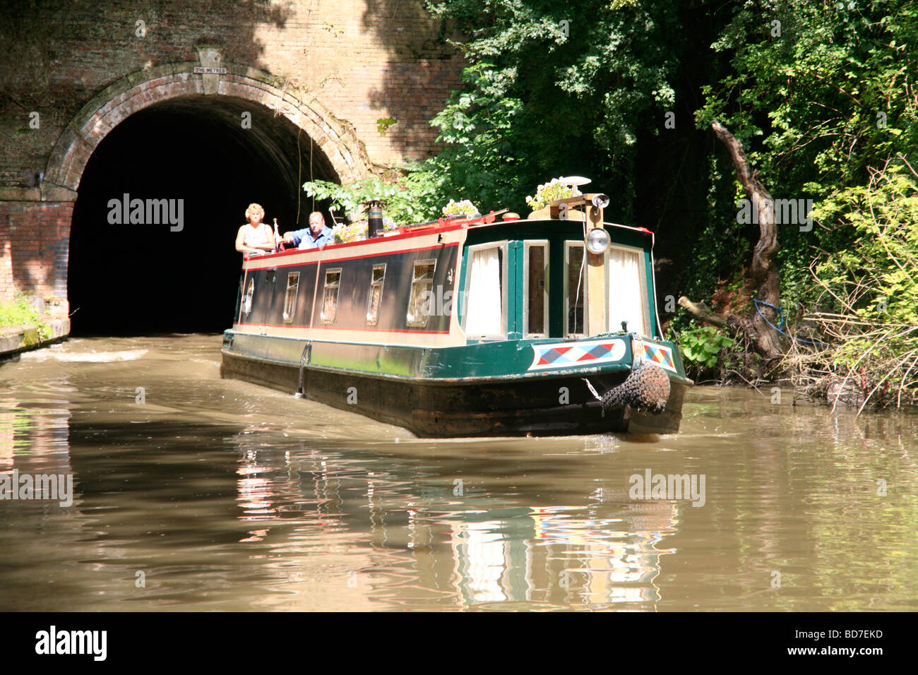 Narrowboat emerging from Shrewley Tunnel Grand Union Canal Warwickshire England Stock Photo