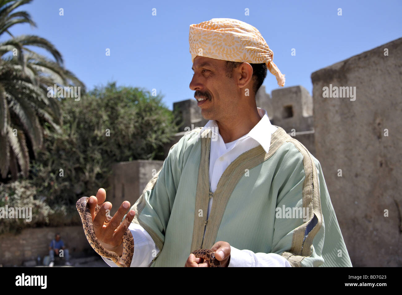 Snake charmer holding snake, Medina, Tangier, Tangier-Tétouan Region, Morocco Stock Photo