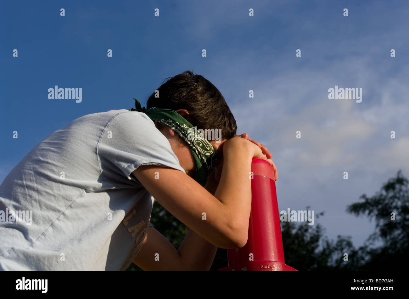 Boy with blindfold hiding and seeking Stock Photo
