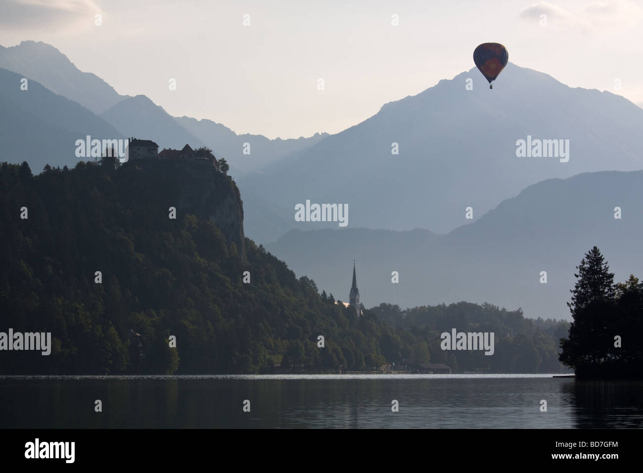 Early Morning on Lake Bled Island with Hot Air Balloon Stock Photo