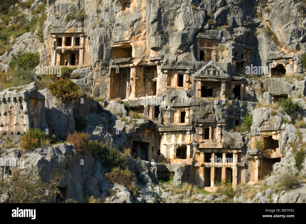 Tombs carved into mountainside Stock Photo