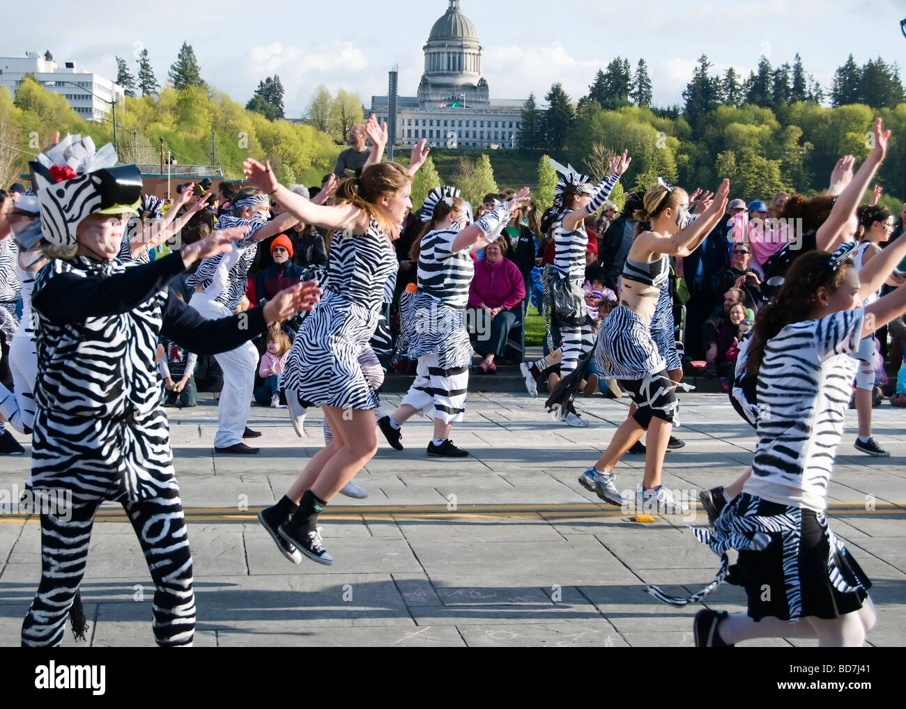 Procession of the Species Parade participants in downtown Olympia