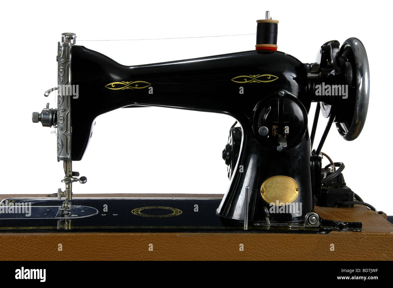 Vintage Sewing machine isolated over a white background Stock Photo - Alamy